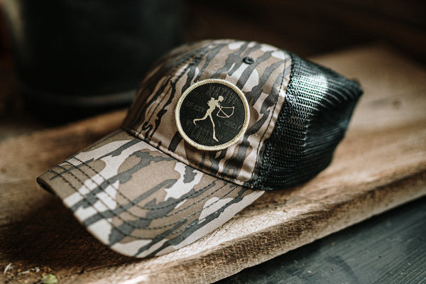 Vintage Mossy Oak with black mesh.